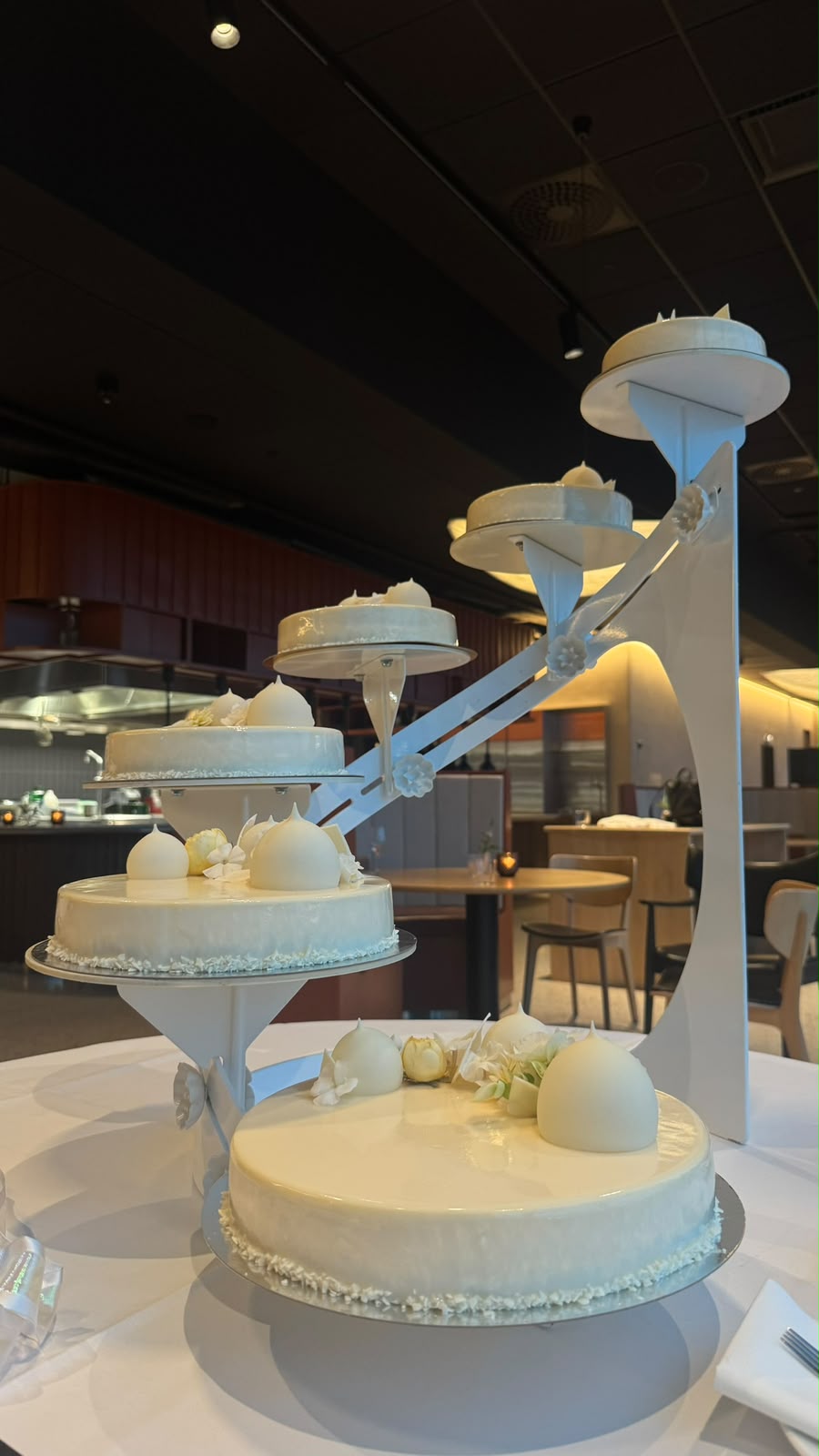 White wedding cakes on a rising stand