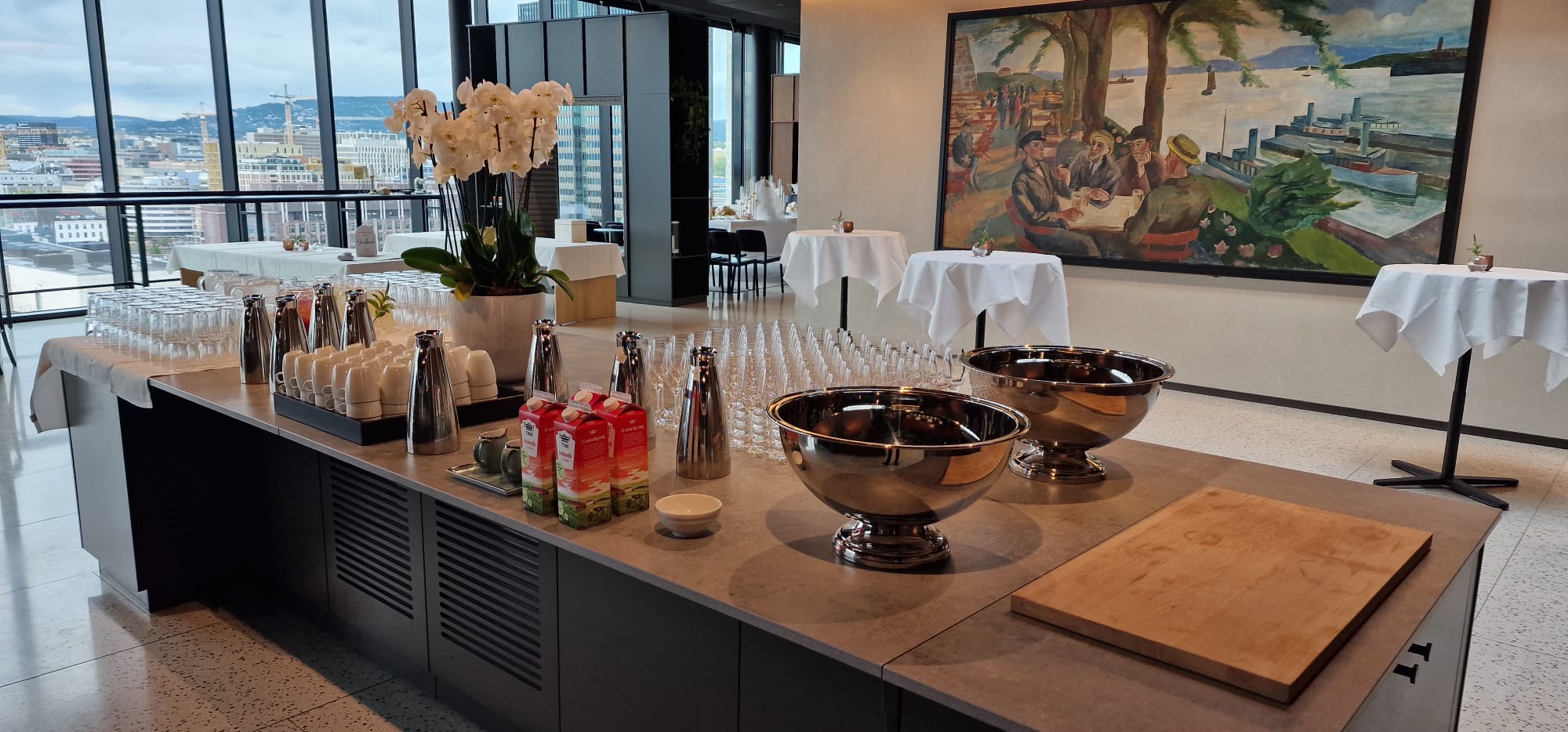 Reception drinks station with orchids and artwork